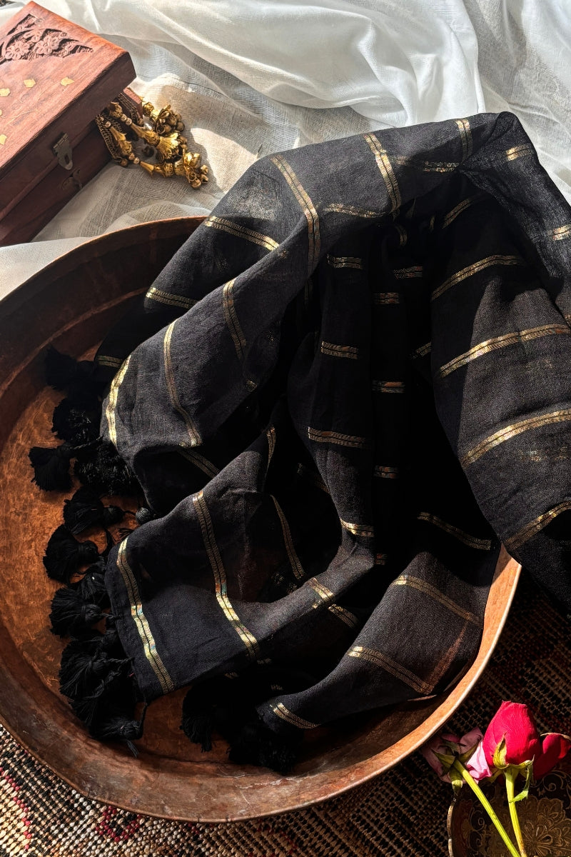 Saanjh Black Soft Mulmul Cotton Saree with Gold Zari Stripes and Tassels - Qatha 