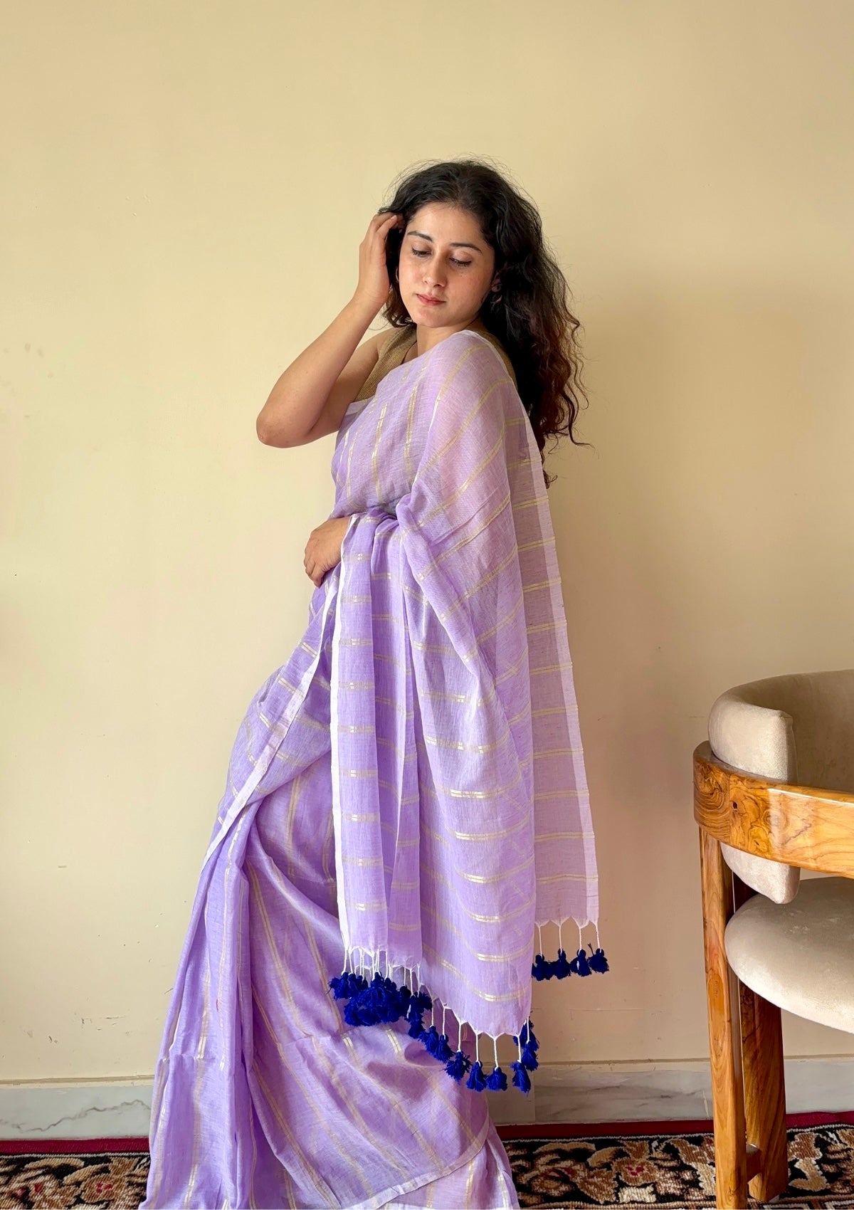 Ira  Light Purple Soft Mulmul Cotton Saree with Gold Zari Stripes and Tassels - Qatha 