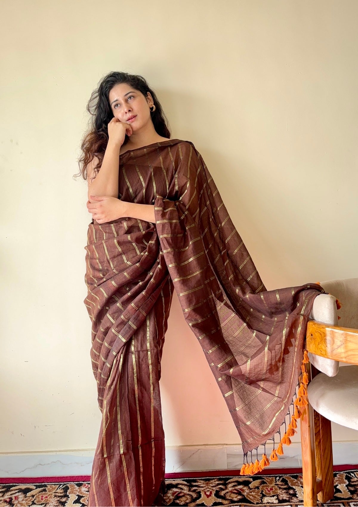 Vedika  Chocolate Brown Mulmul Cotton Saree with Gold Zari Stripes and Tassels - Qatha 