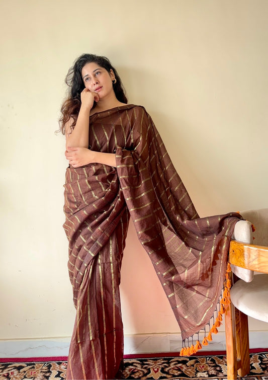 Vedika  Chocolate Brown Mulmul Cotton Saree with Gold Zari Stripes and Tassels - Qatha 