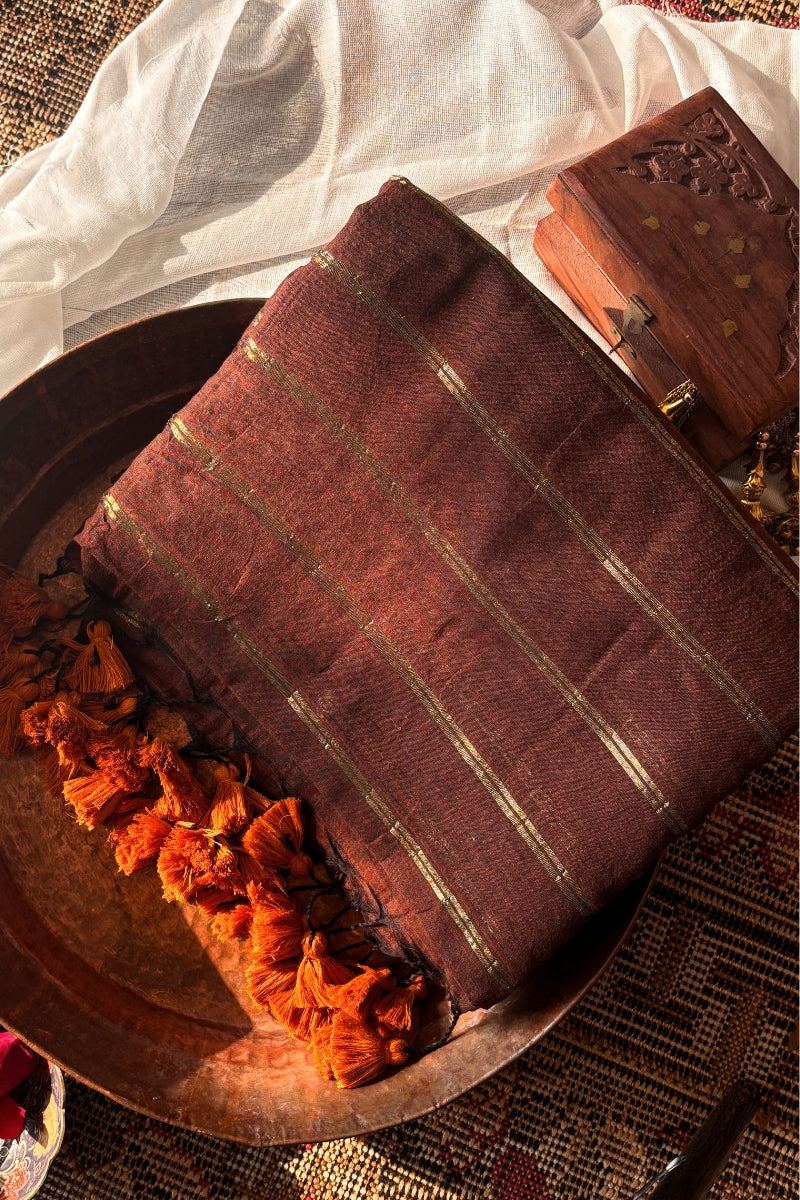 Vedika  Chocolate Brown Mulmul Cotton Saree with Gold Zari Stripes and Tassels - Qatha 
