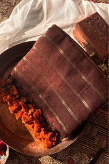 Vedika  Chocolate Brown Mulmul Cotton Saree with Gold Zari Stripes and Tassels - Qatha 