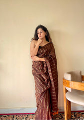 Vedika  Chocolate Brown Mulmul Cotton Saree with Gold Zari Stripes and Tassels - Qatha 