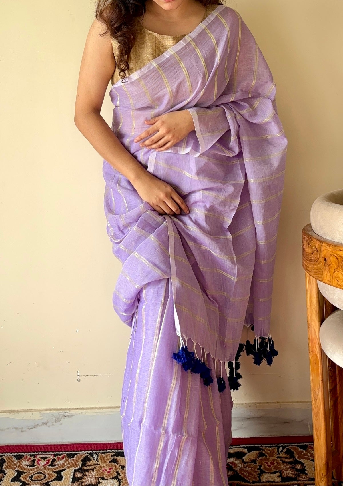 Ira  Light Purple Soft Mulmul Cotton Saree with Gold Zari Stripes and Tassels - Qatha 