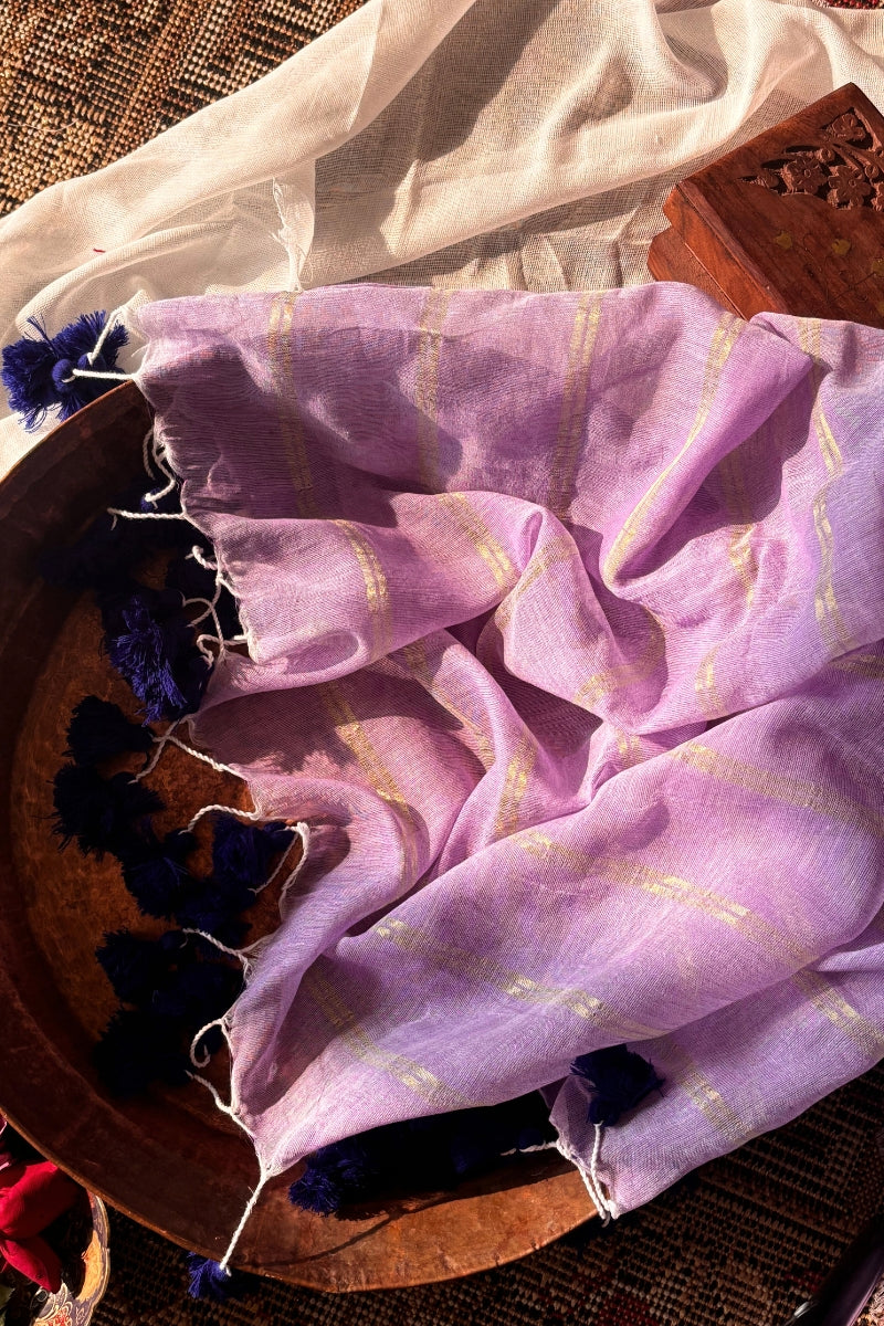 Ira  Light Purple Soft Mulmul Cotton Saree with Gold Zari Stripes and Tassels - Qatha 